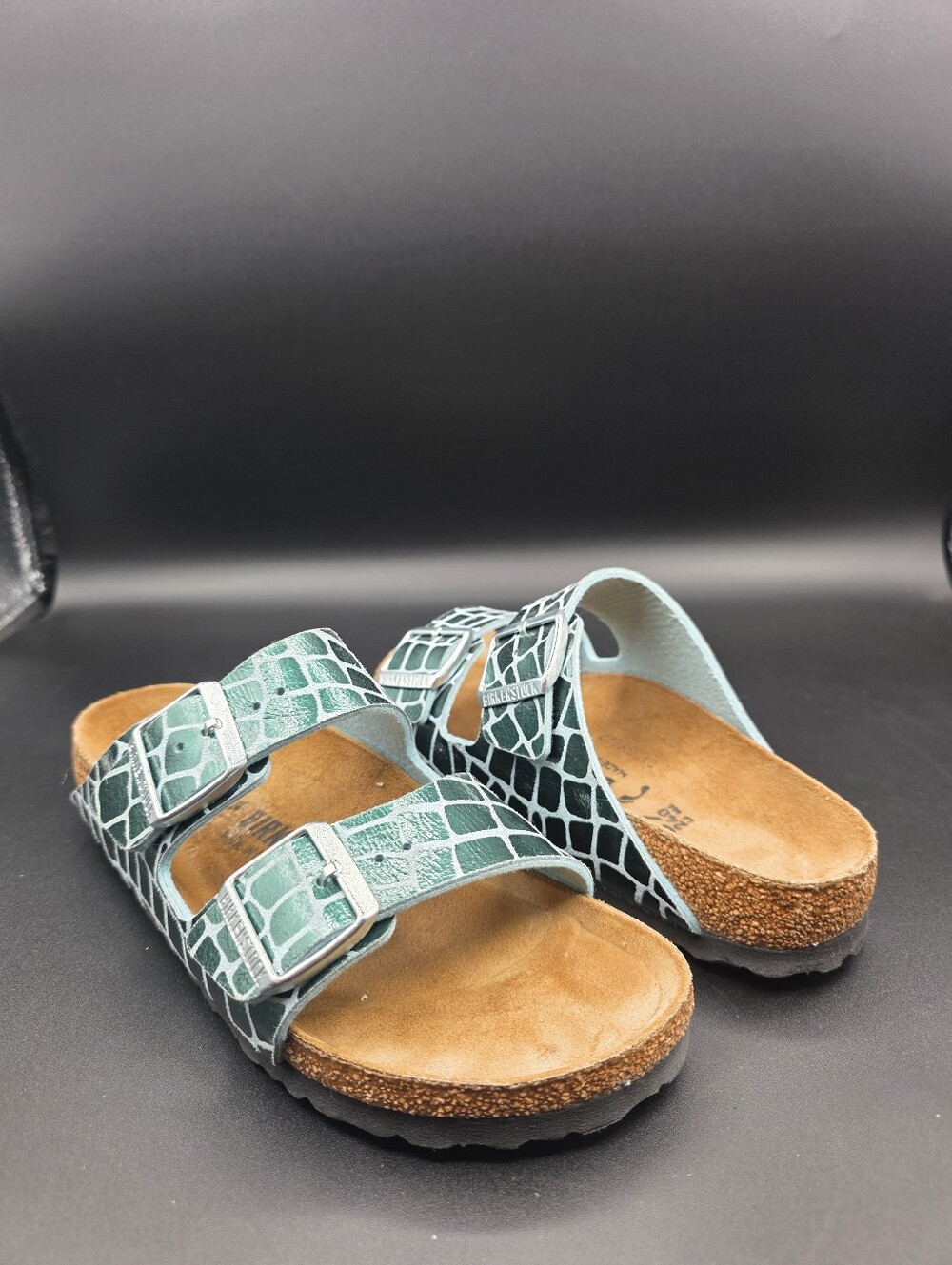 Birkenstock Arizona Gator Gleam sandals in the Ocean Breeze metallic green color